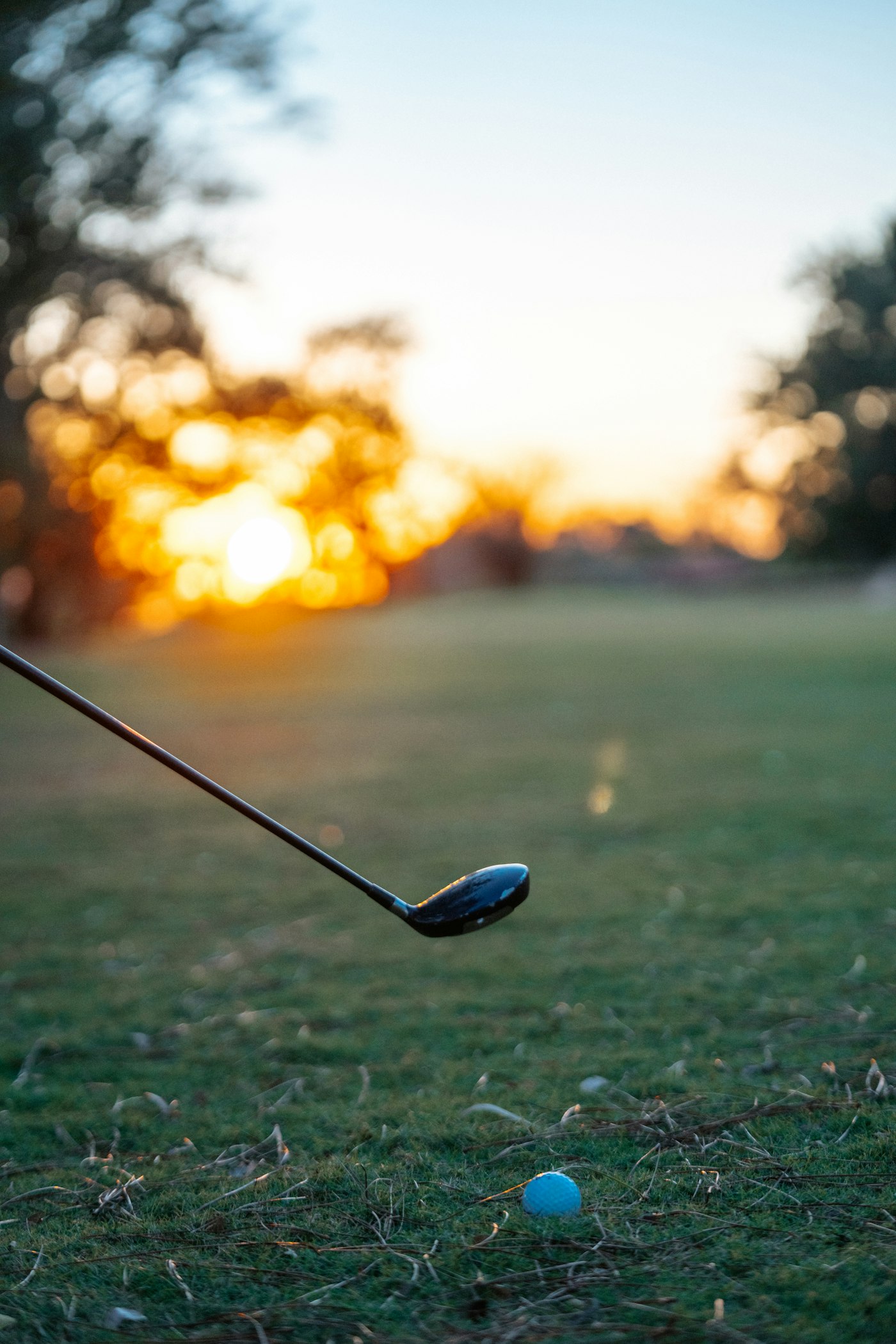 A golfer lining up a shot on the fairway